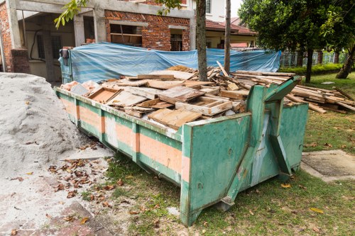 Image showing a team preparing for garden clearance with protective gear